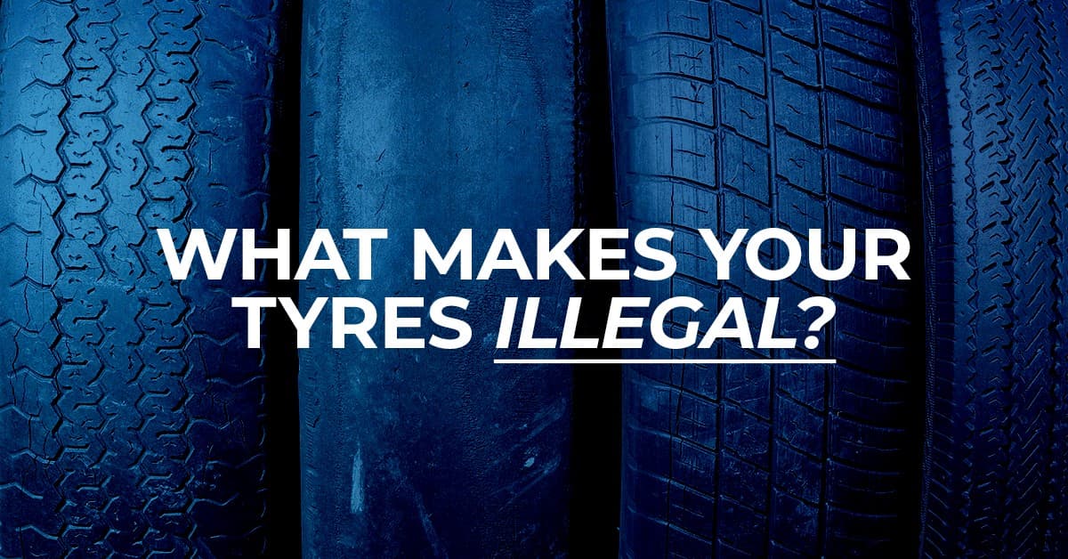 The article title over four tyres stood on their sides in a row, with a blue overlay.