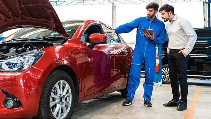 Men discussing a car