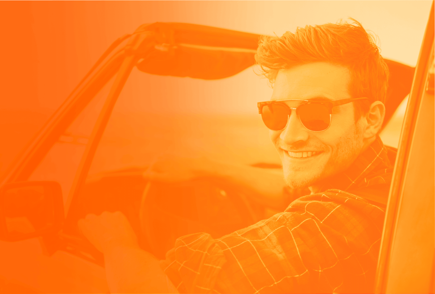 man smiling in a car